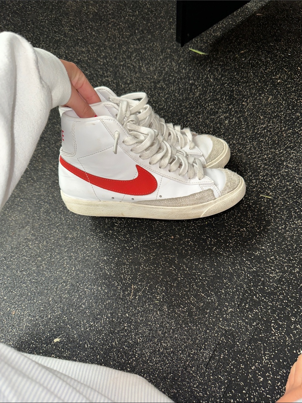 Nike White High-Top Sneakers with Red Swoosh
